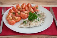 Seelachsfilet mit frischen Tomaten